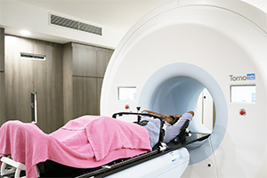 Patient in imaging machine at a cancer centre in Klang for colon cancer, prostate cancer, chemotherapy, or SBRT treatment.